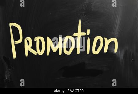 Promotion handwritten with white chalk on a blackboard Stock Photo