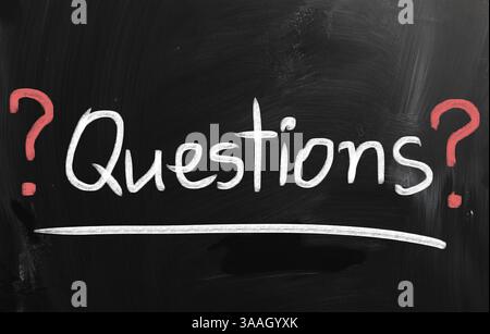 Question, handwritten with white chalk on a blackboard Stock Photo