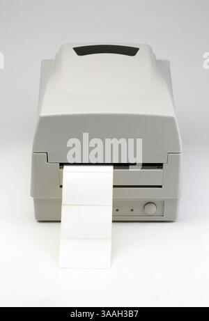 Label printer with blank message ready to insert message of your choice. The image is on a gray background Stock Photo