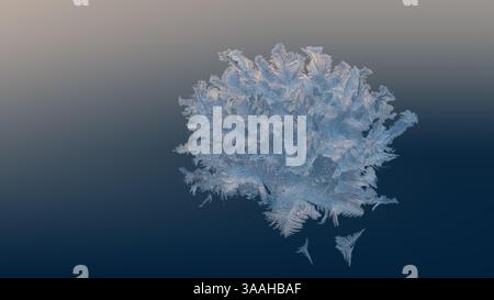 Macro close up of frostwork. Natural ice pattern on window on background of gradient from beige-orange to dark blue. Stock Photo