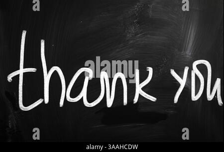 Thank you handwritten with chalk on blackboard Stock Photo - Alamy