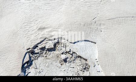Surface of white carbonate mineral plateau or travertine terrace close up in Pamukkale or cotton castle, Denizli Province, Turkey. Unesco world herita Stock Photo