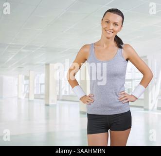 Beautiful sportswoman wearing sports clothes Stock Photo