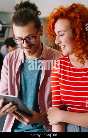 Team of programmers writing digital code in the metaverse and working together on the internet Stock Photo