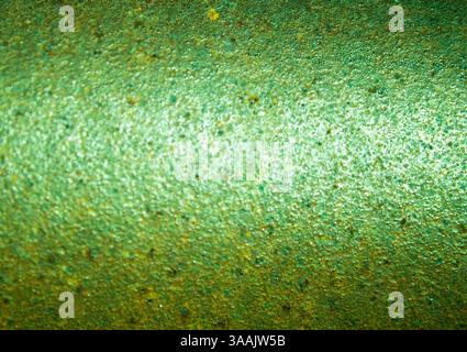 Corroded metal surface with green rust creating a textured background Stock Photo