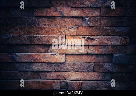 Interesting facade decorative bricks under dramatic lighting. Stock Photo