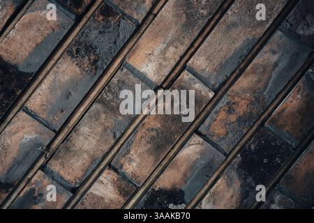 Interesting facade decorative bricks under dramatic lighting. Stock Photo