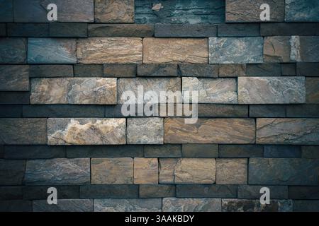Interesting facade decorative bricks under dramatic lighting. Stock Photo