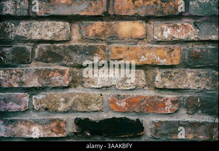 Interesting facade decorative bricks under dramatic lighting. Stock Photo