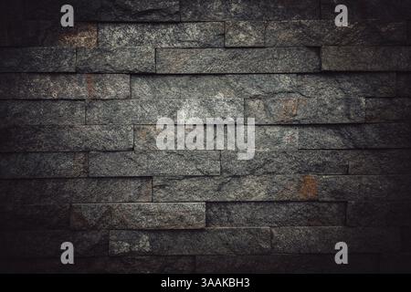 Interesting facade decorative bricks under dramatic lighting. Stock Photo