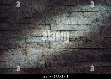 Interesting facade decorative bricks under dramatic lighting. Stock Photo