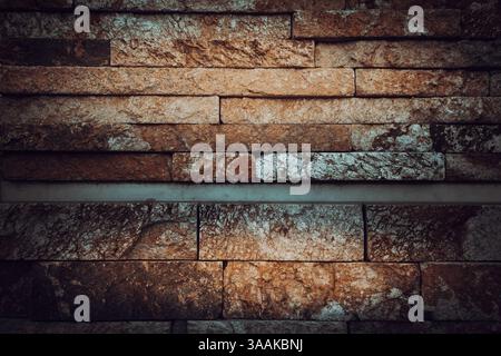 Interesting facade decorative bricks under dramatic lighting. Stock Photo