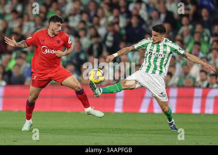 Isaac Romero of Sevilla FC and Marc Bartra of Real Betis during the La ...