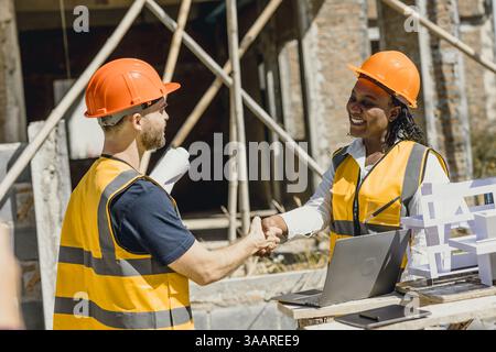 Professional engineer male handshake for teamwork builder contractor acquisition and successful negotiate, Shake hand with partner dealing constructio Stock Photo