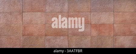 Wall cladding made of large reddish-brown rectangular stone slabs - panorama Stock Photo