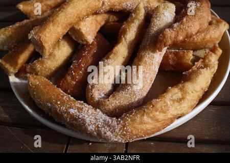 Crispy churros with hot melted chocolate for dipping Stock Photo