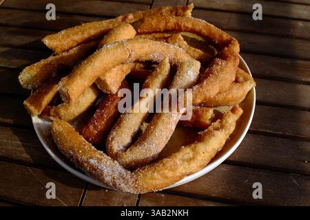 Crispy churros with hot melted chocolate for dipping Stock Photo