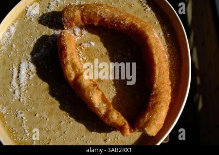 Crispy churros with hot melted chocolate for dipping Stock Photo