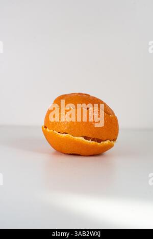 Spiral form of orange peel isolated on a white background, top view. Stock Photo