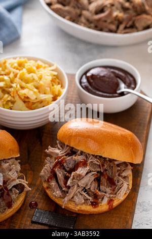 Pulled pork sandwiches on brioche buns with BBQ sauce and sauteed cabbage Stock Photo