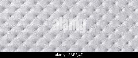 Texture of light gray and silver leather background with capitone pattern, macro. Pearl textile of retro Chesterfield style. Vintage fabric backdrop. Stock Photo