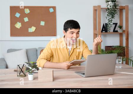 Young man having job interview online at home Stock Photo