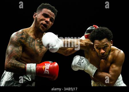 April 13, 2018 - Minnesapolis, MN, USA - Haskell Rhodes, right, of Las Vegas, connects with a right hook to Mike Fowler, of Milwaukee, during their lightweight match at the Armory in Minneapolis on Friday, April 13, 2018. (Credit Image: © Aaron Lavinsky/TNS via ZUMA Wire) Stock Photo