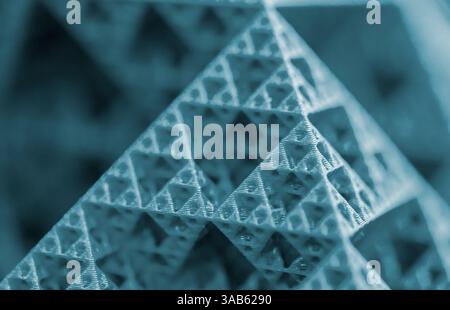 Small model of pyramid printed on 3D printer close-up. Object created ...