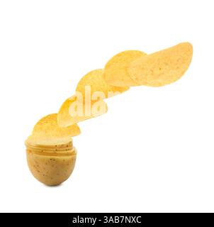 Raw potato slices transforming into crispy chips in air on white background Stock Photo