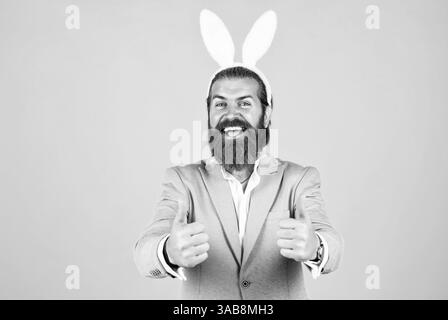 Getting ready for this. celebrating easter in springtime. funny man in rabbit costume. happy easter. man imagine he is rabbit. male wear bunny ears Stock Photo