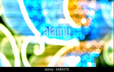 Colorful abstract patterns swirl and shift in an engaging display of light, showcasing hues of blue, orange, and green that evoke a sense of movement Stock Photo