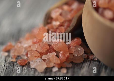 Himalayan pink salt  on wooden surface Stock Photo