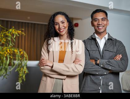 Confident Professionals Posing Together in a Modern Office Setting Stock Photo