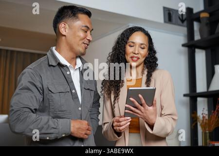 Professional Interaction Between Colleagues in a Hotel Lobby Setting Stock Photo