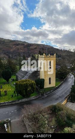 Aerial vertorama view of the historic St Oswald's Church in the lakeside village of Grasmere and  in The English Lake District National Park the resti Stock Photo