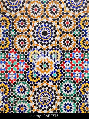 Morocco, Rabat. Typical historical glazed mosaic ceramic wall tiles with an Islamic geometric pattern. Fountain wall. Stock Photo