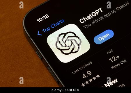 ChatGPT app is seen in the App Store on the screen of an iPhone. ChatGPT is a generative AI chatbot developed by OpenAI. Stock Photo