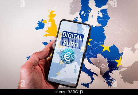 Hand holding smartphone showing digital euro with european union map Stock Photo