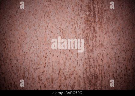 Rusted orange painted metal wall, Rusty metal background with streaks of rust, Rust of metals, Corrosive Rust on old iron with a hole. Old shabby pain Stock Photo