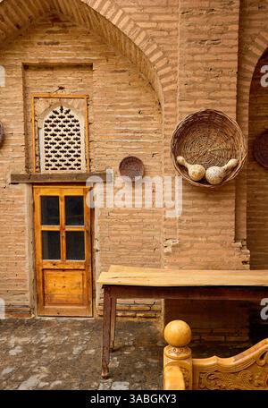 Old style exterior of carpet workshop with door and decoration on the wall in city Khiva, Uzbekistan. Stock Photo