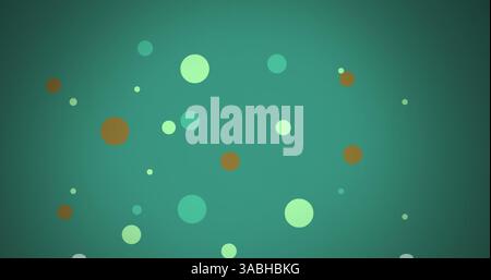 Image of multi coloured dots moving over green background Stock Photo