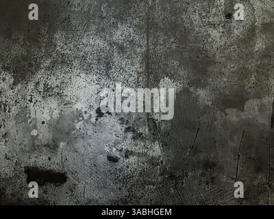 old grungy dark grey wall with crack for background or texture Stock Photo