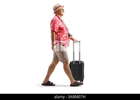 Male tourist walking with a small suitcase isolated on white background Stock Photo
