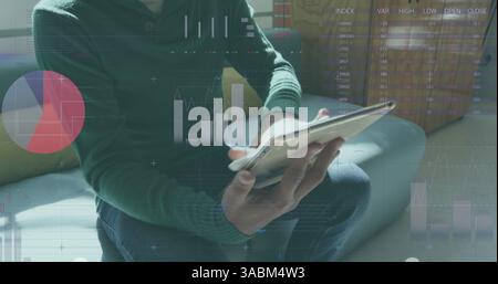 Statistical data processing against man using digital tablet at office Stock Photo
