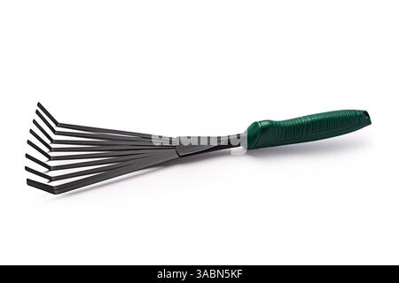 Small garden rake isolated on white background. Gardening tools. Stock Photo