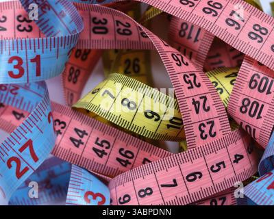 A pile of colorful tape measures. Close up. Stock Photo