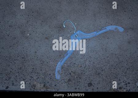 Blue Hanger on Grey Asphalt Stock Photo