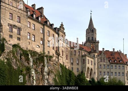 Majestic Sigmaringen Castle Perched on Rugged Cliff Above Tranquil Danube: Historic Hohenzollern Residence Showcases Medieval Architecture and Royal Stock Photo