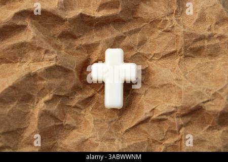 Faith and religion that heal, wrinkled brown background Stock Photo