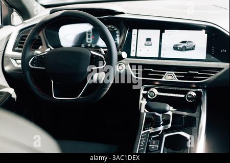 steering wheel and control buttons in an expensive new car. High quality photo Stock Photo
